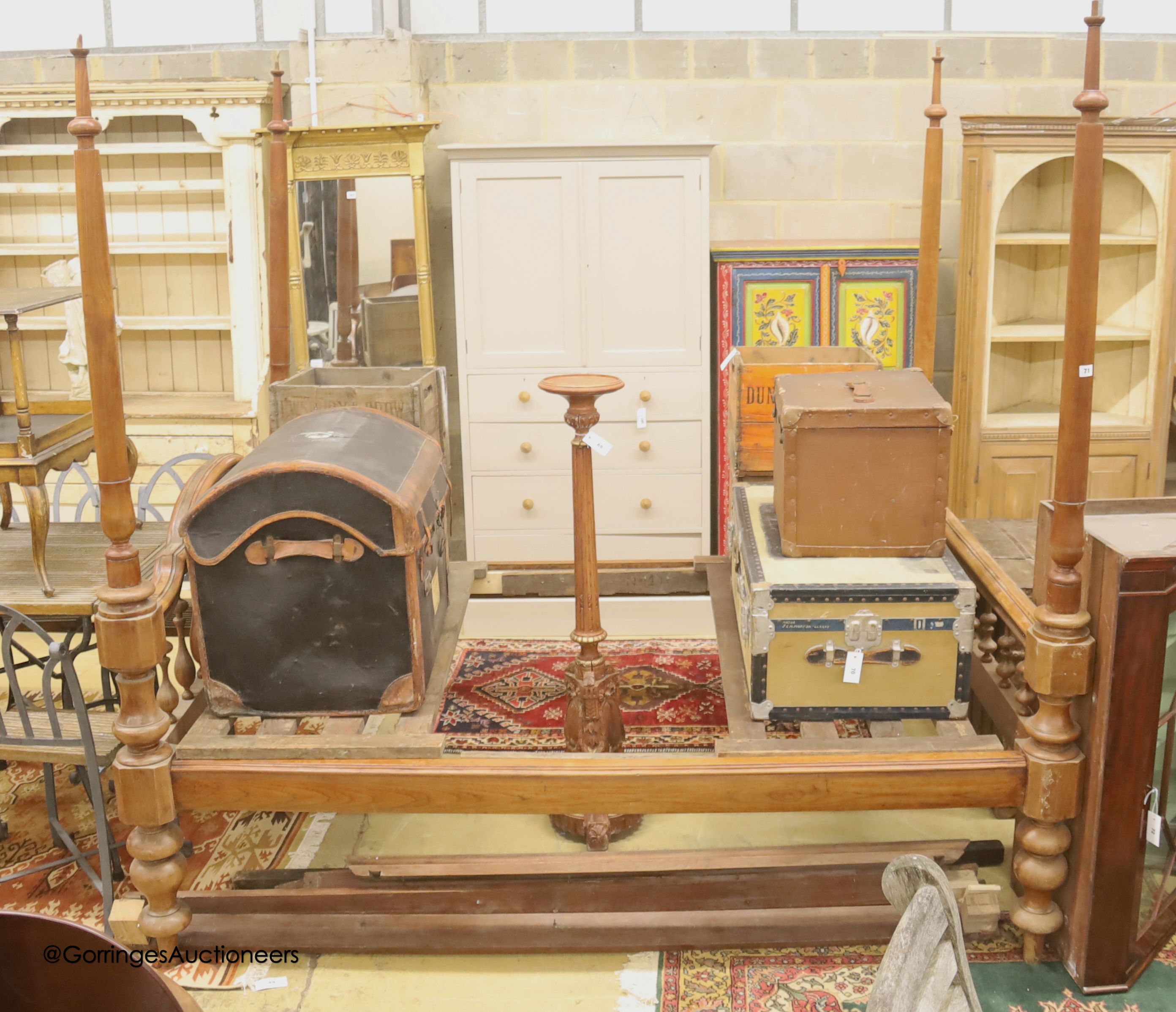An Indonesian carved hardwood four poster bed, width 144cm, length 206cm